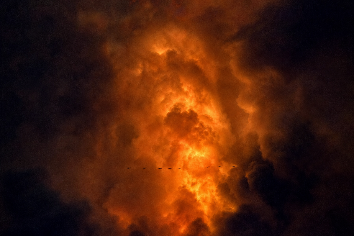 Dense wildfire smoke representing outdoor air pollution